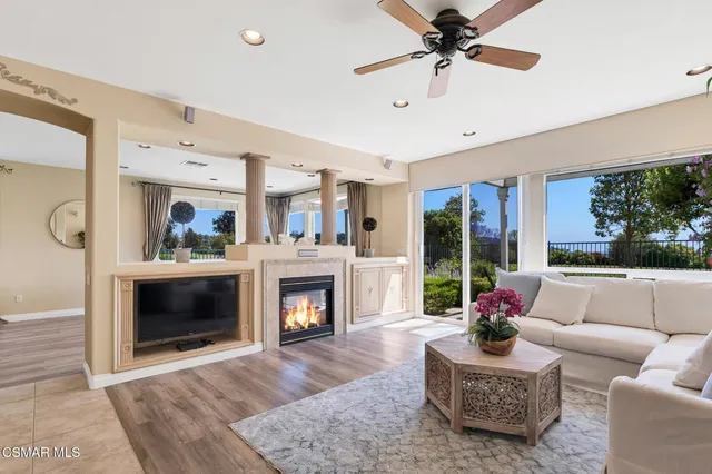 a kitchen with a sink window and cabinets