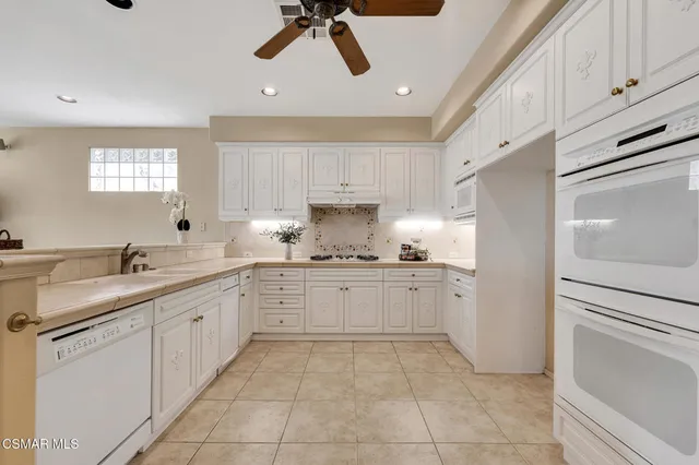 a bathroom with a sink mirror and toilet
