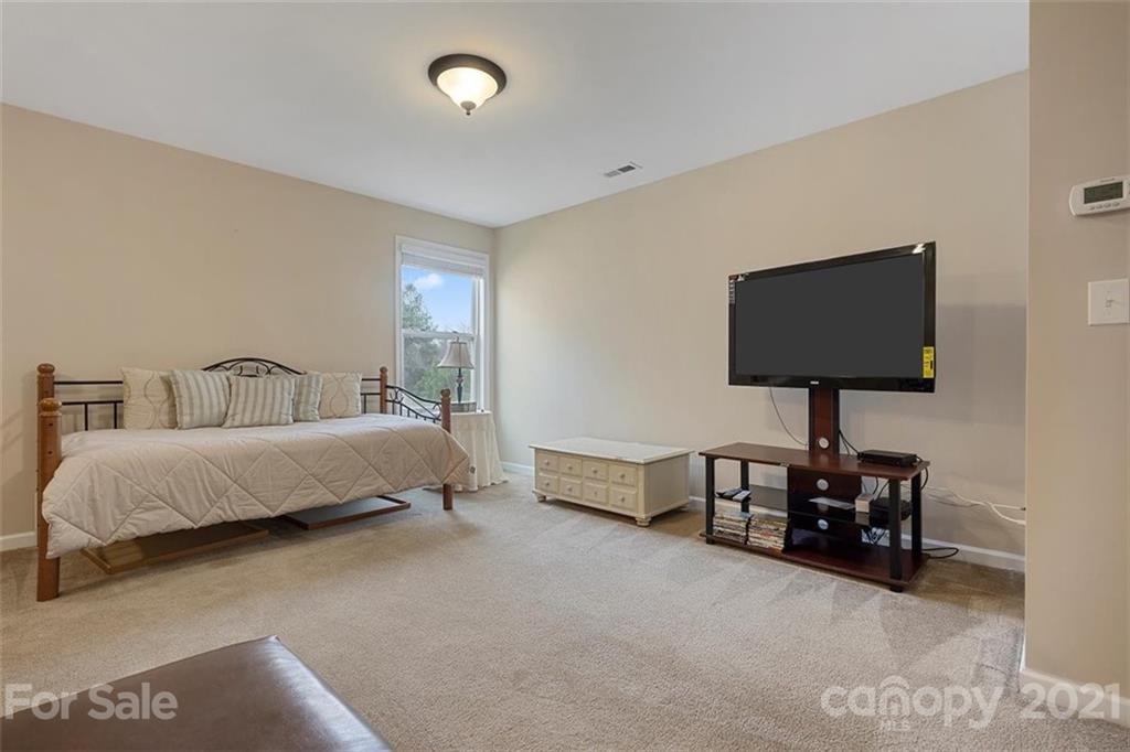 78150 Rillstone Drive Lancaster, SC 29720 - Photo 11 of 41 a bedroom with a bed and a lamp on table