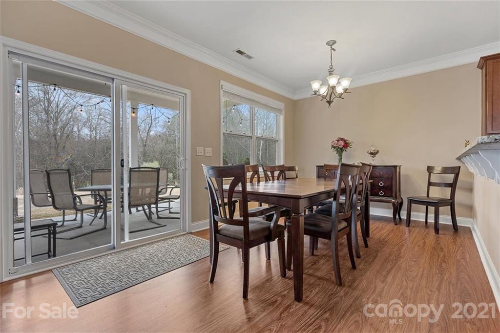 78150 Rillstone Drive Lancaster, SC 29720 - Photo 18 of 41 a view of a dining room with furniture window and wooden floor