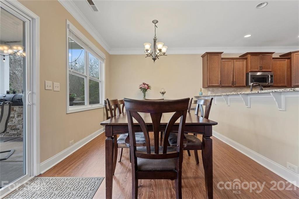 78150 Rillstone Drive Lancaster, SC 29720 - Photo 19 of 41 a view of a dining room with furniture and wooden floor