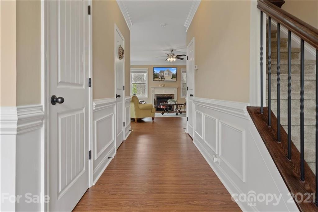 78150 Rillstone Drive Lancaster, SC 29720 - Photo 3 of 41 a view of a hallway with wooden floor and staircase