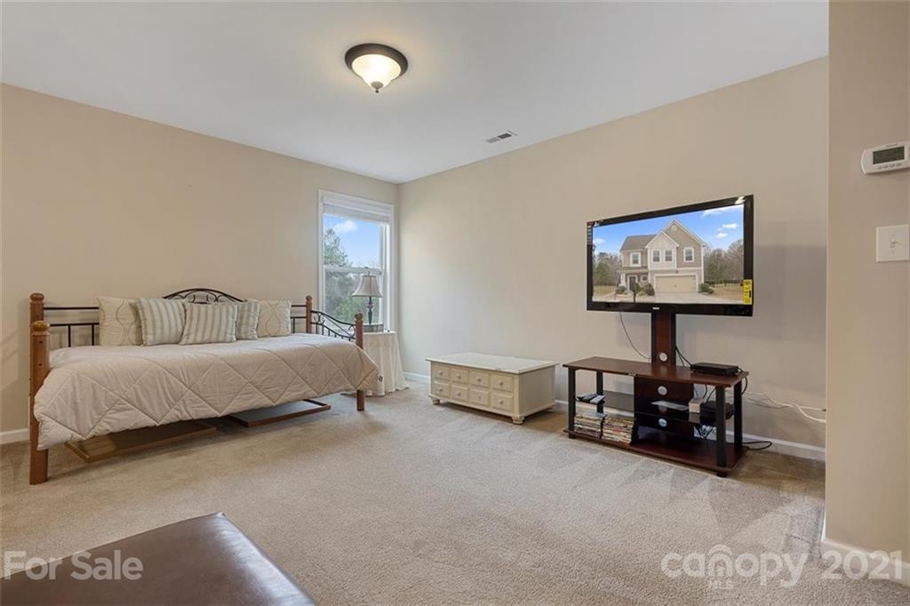 78150 Rillstone Drive Lancaster, SC 29720 - Photo 21 of 41 a bedroom with a bed and a lamp on table