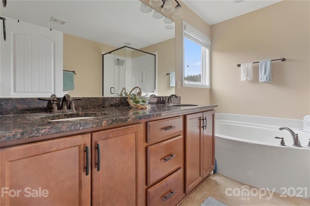 78150 Rillstone Drive Lancaster, SC 29720 - Photo 29 of 41 a bathroom with a granite countertop double vanity sink and mirror