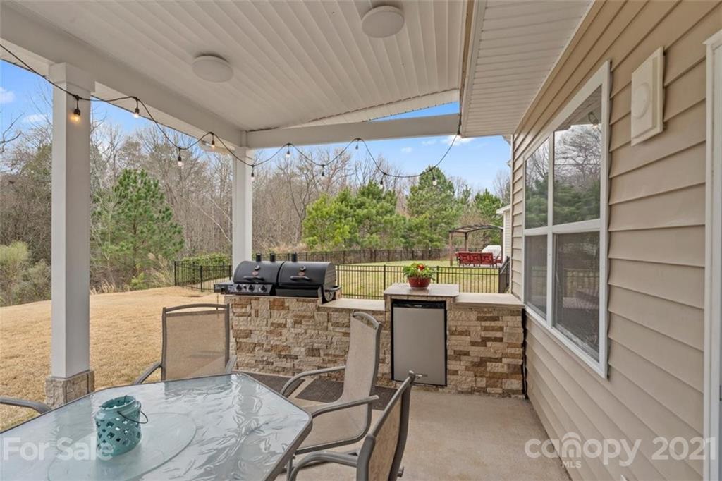78150 Rillstone Drive Lancaster, SC 29720 - Photo 32 of 41 a view of an outdoor dining space with a table and chairs
