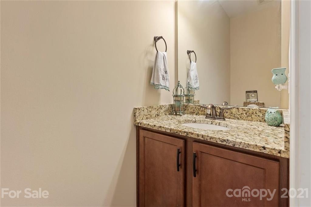 78150 Rillstone Drive Lancaster, SC 29720 - Photo 6 of 41 a bathroom with a granite countertop sink and a mirror