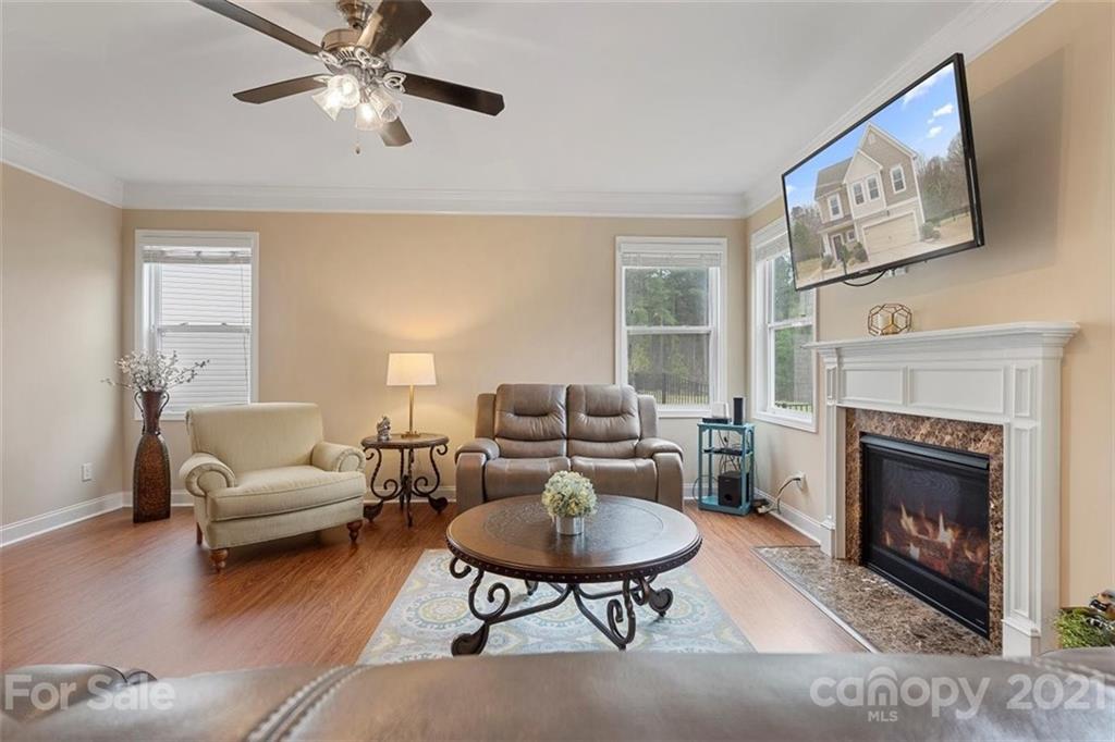 78150 Rillstone Drive Lancaster, SC 29720 - Photo 10 of 41 a living room with furniture and a fireplace