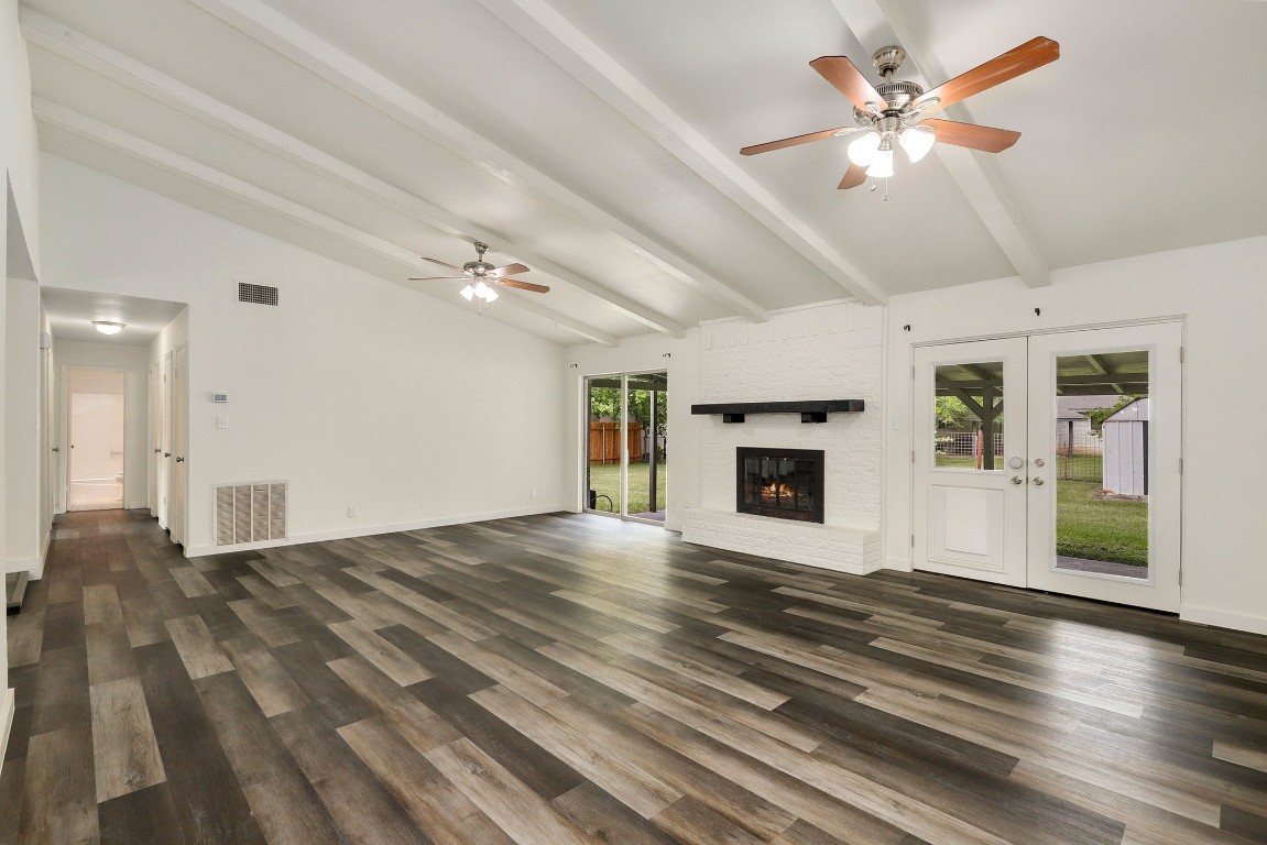 1008 Ridgeline Drive Round Rock, TX 78664 - Photo 15 of 30 a view of an empty room with window and wooden floor