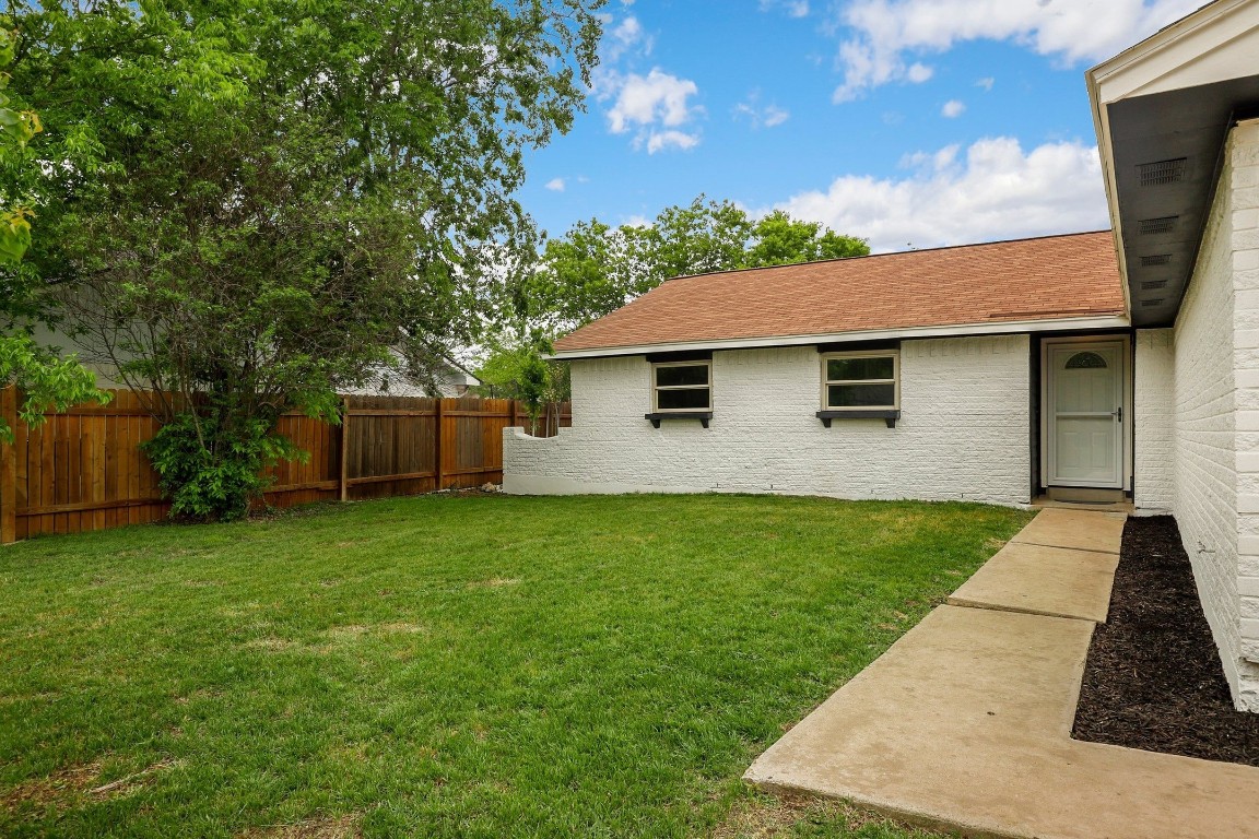1008 Ridgeline Drive Round Rock, TX 78664 - Photo 2 of 30 a front view of a house with garden