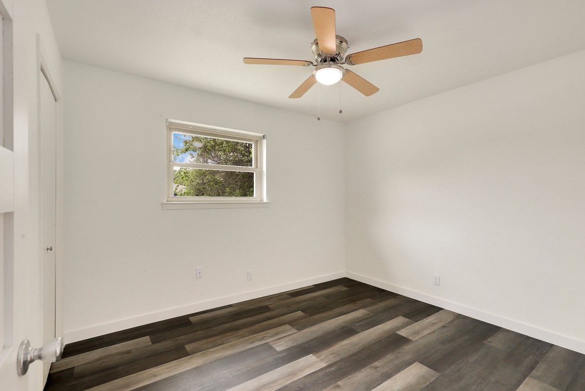 1008 Ridgeline Drive Round Rock, TX 78664 - Photo 22 of 30 an empty room with wooden floor and fan