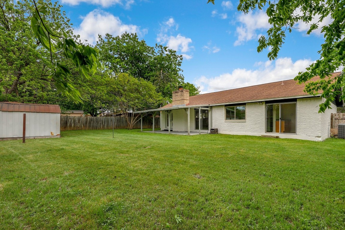 1008 Ridgeline Drive Round Rock, TX 78664 - Photo 25 of 30 a front view of a house with a garden
