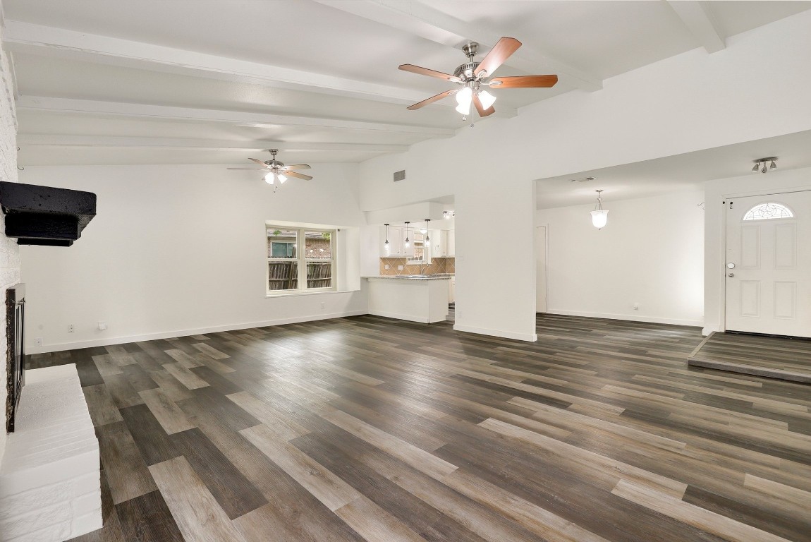 1008 Ridgeline Drive Round Rock, TX 78664 - Photo 6 of 30 a view of an empty room with a window and wooden floor