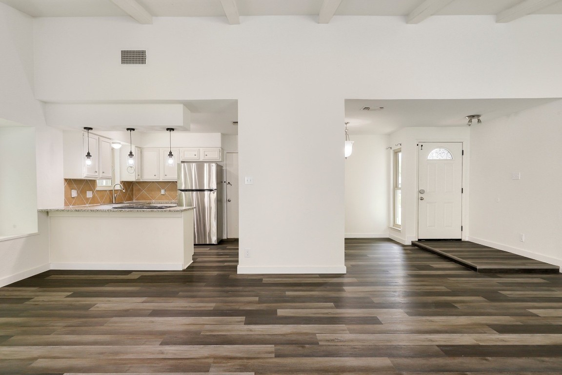 1008 Ridgeline Drive Round Rock, TX 78664 - Photo 7 of 30 a view of kitchen with stainless steel appliances granite countertop cabinets and wooden floor