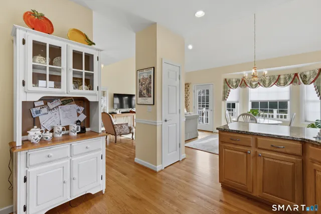 a kitchen with stainless steel appliances granite countertop a stove and cabinets