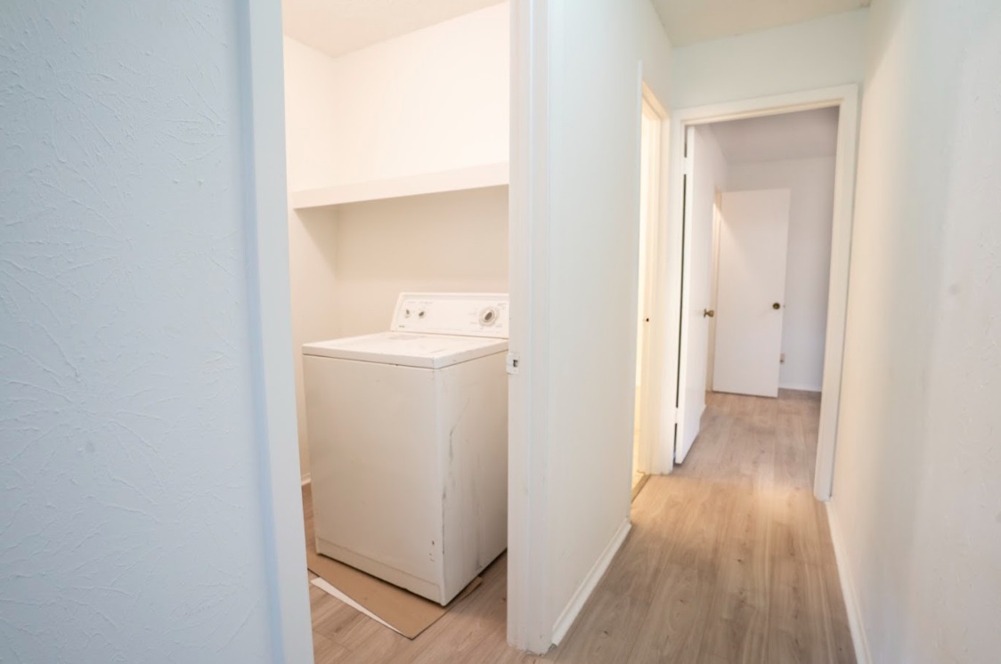 906 Silver Quail Lane Austin, TX 78758 - Photo 18 of 33 Laundry room with washer / clothes dryer and light wood-style flooring