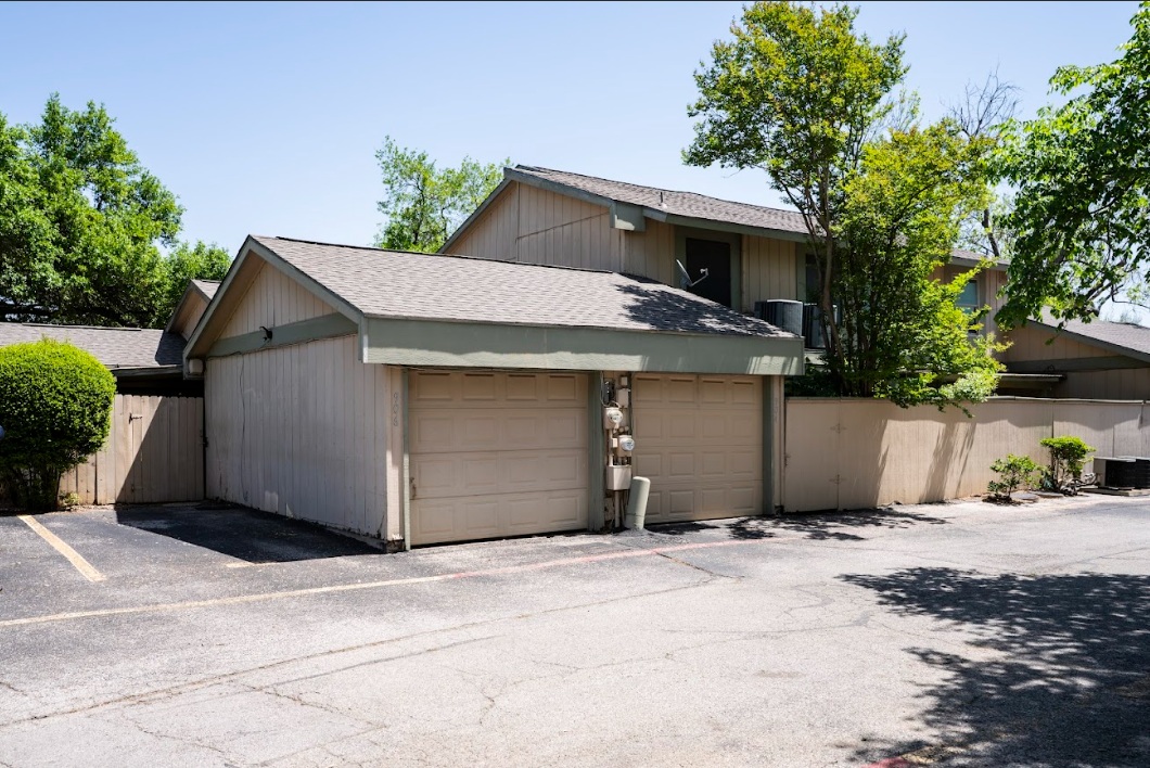 906 Silver Quail Lane Austin, TX 78758 - Photo 29 of 33 Rear Property View of Garage door and secured parking spot
