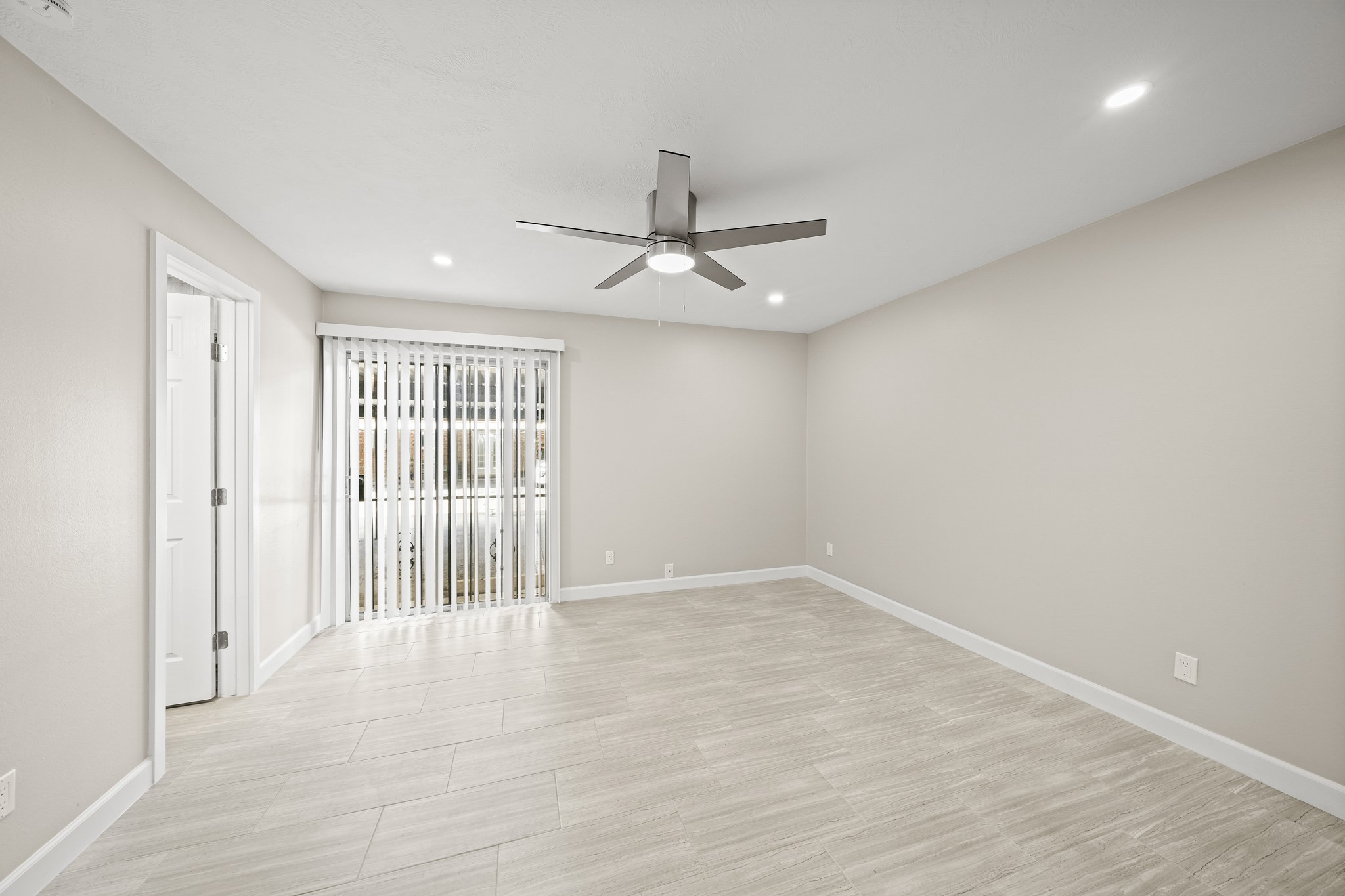 2201 Fountain View Drive, Unit 25 Houston, TX 77057 - Photo 6 of 12 wooden floor in an empty room with a window