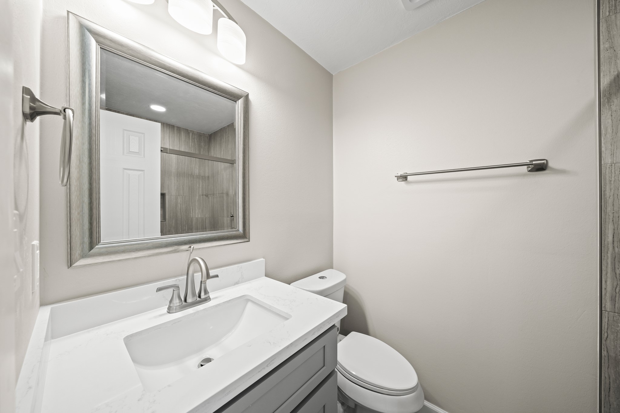 2201 Fountain View Drive, Unit 25 Houston, TX 77057 - Photo 9 of 12 a bathroom with a sink toilet vanity and shower