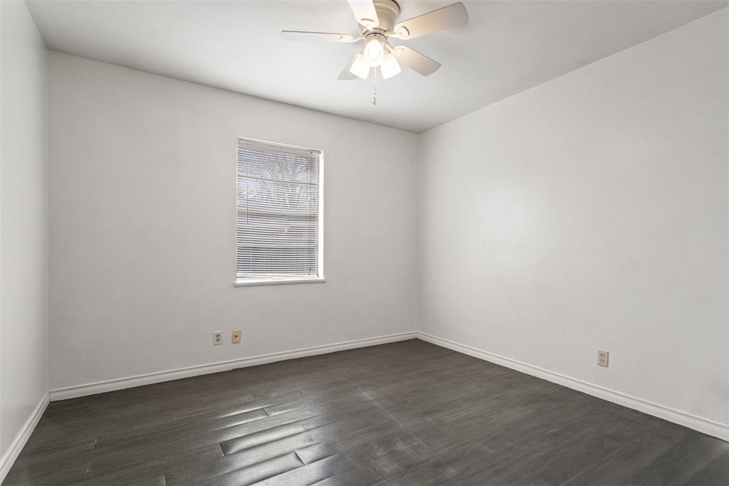 3126 Colgate Avenue Tyler, TX 75701 - Photo 22 of 33 an empty room with a window and ceiling fan