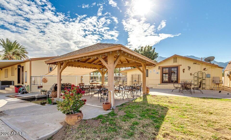 3232 West Carver Road Laveen, AZ 85339 - Photo 4 of 6 a view of a house with outdoor seating space