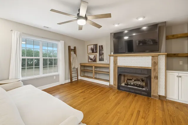 a view of a room with a gym equipment and a large window