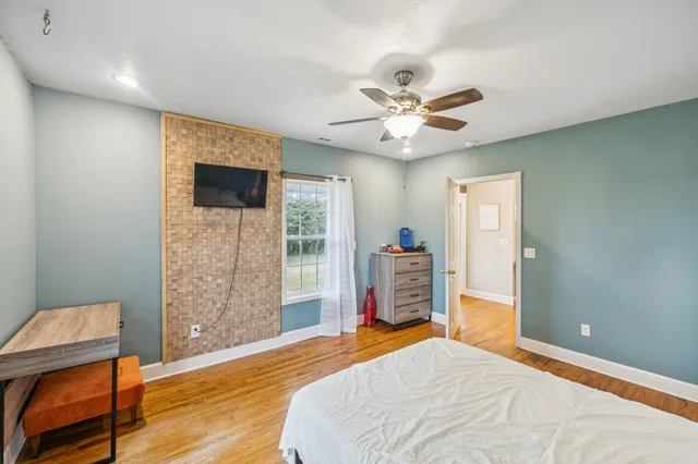 a en suite bathroom with a sink a mirror and a shower