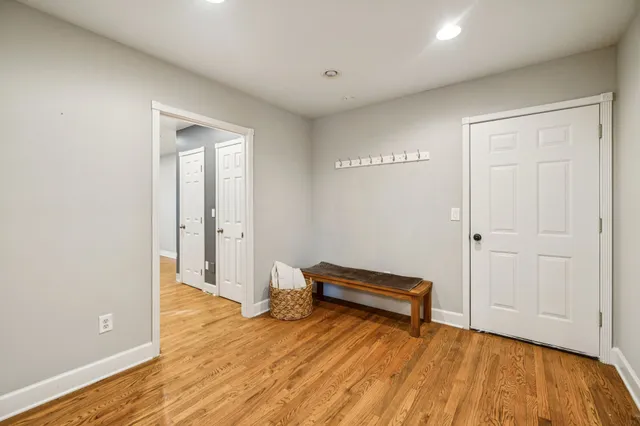 a bedroom with furniture and a flat screen tv