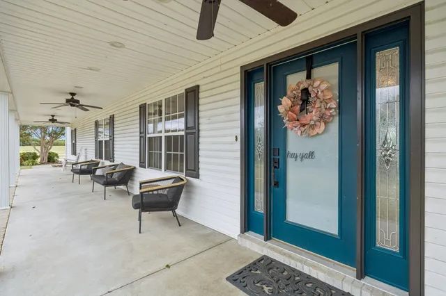 a kitchen with granite countertop a sink a counter space appliances and cabinets