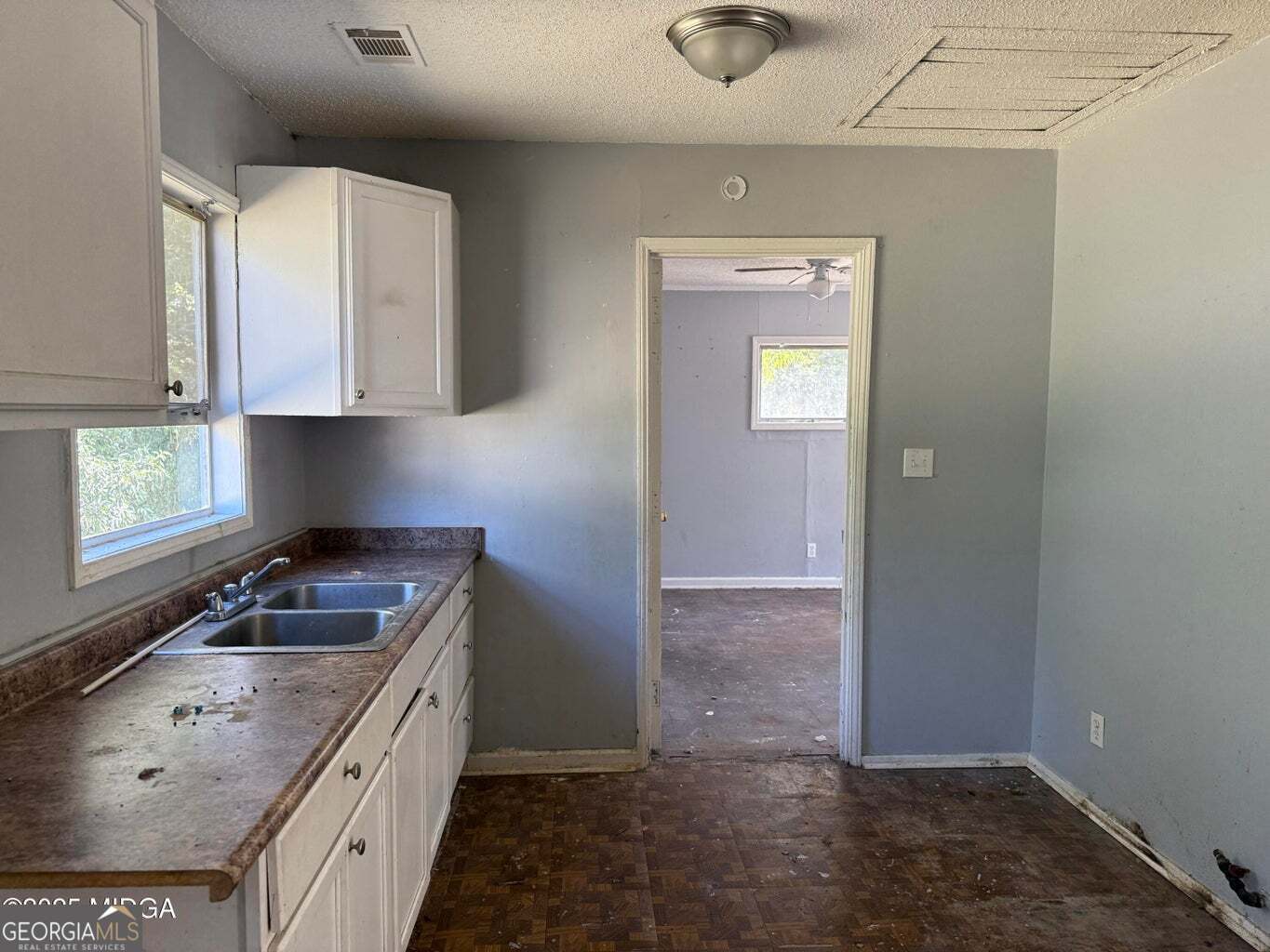 3480 Travis Boulevard Macon, GA 31206 - Photo 18 of 19 a kitchen with a sink stove and cabinets