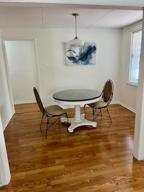 538 West 3rd Street Riviera Beach, FL 33404 - Photo 6 of 10 a view of a dining room with furniture and wooden floor