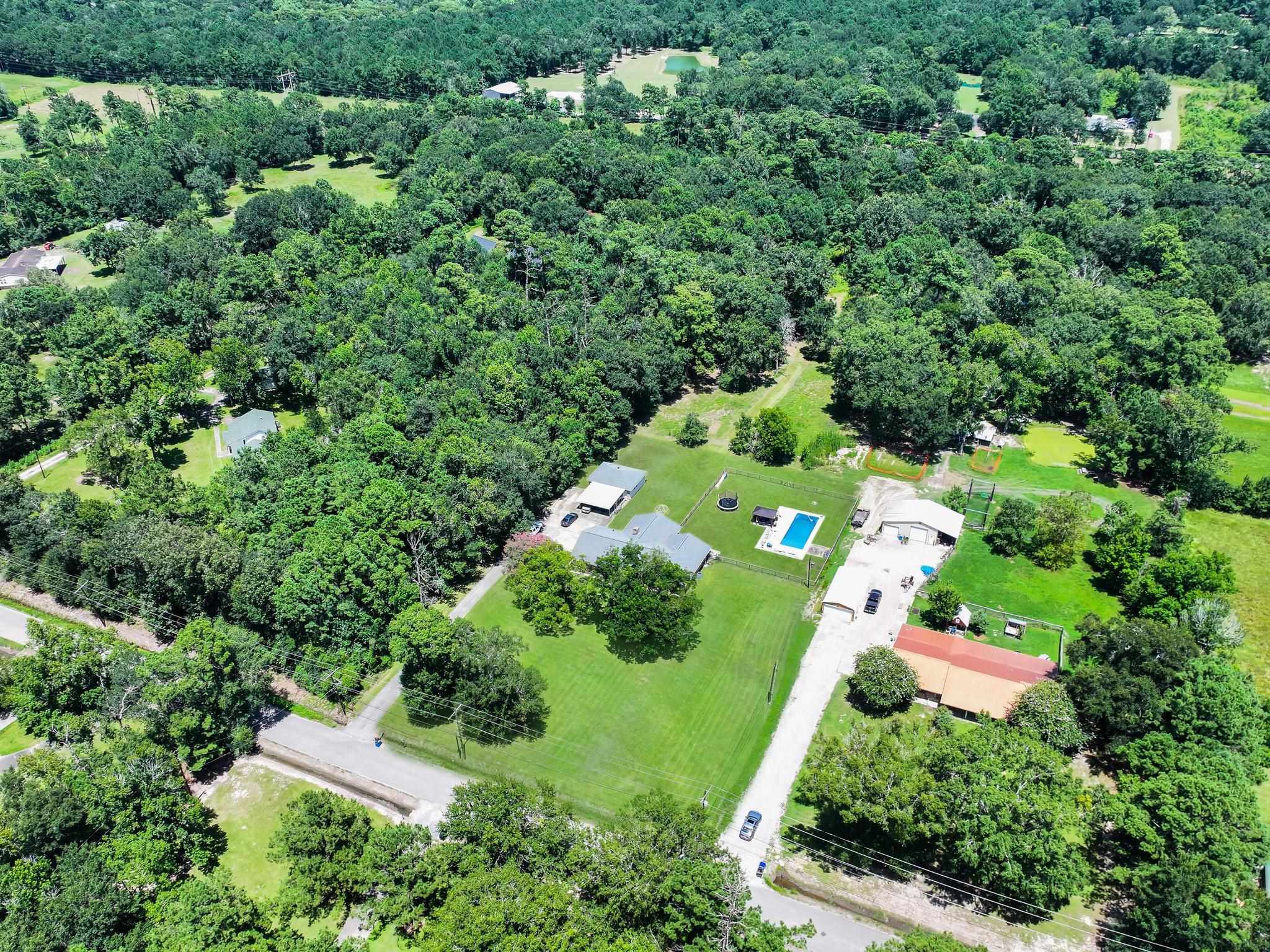 2641 Oilla Road Orange, TX 77630 - Photo 39 of 50 an aerial view of a house with a yard