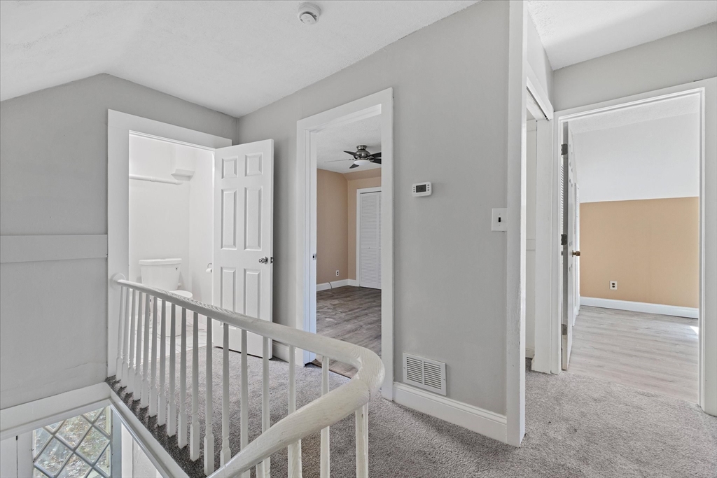17 Otis Street Warren, MA 01083 - Photo 14 of 26 a view of a hallway with wooden floor and staircase