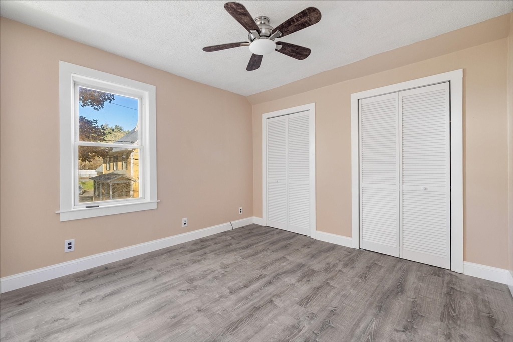 17 Otis Street Warren, MA 01083 - Photo 15 of 26 a view of an empty room with a window and a ceiling fan