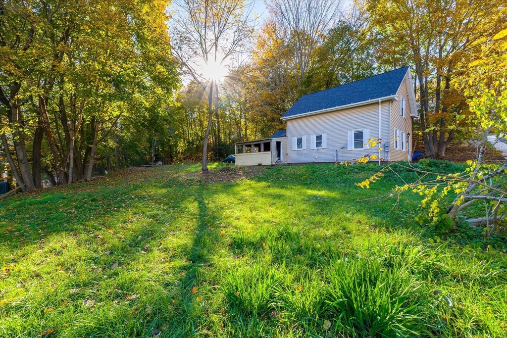 17 Otis Street Warren, MA 01083 - Photo 23 of 26 a backyard of a house with table and chairs