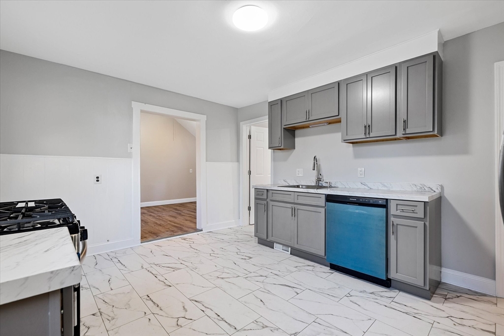 17 Otis Street Warren, MA 01083 - Photo 5 of 26 a kitchen with stainless steel appliances granite countertop a sink stove and refrigerator