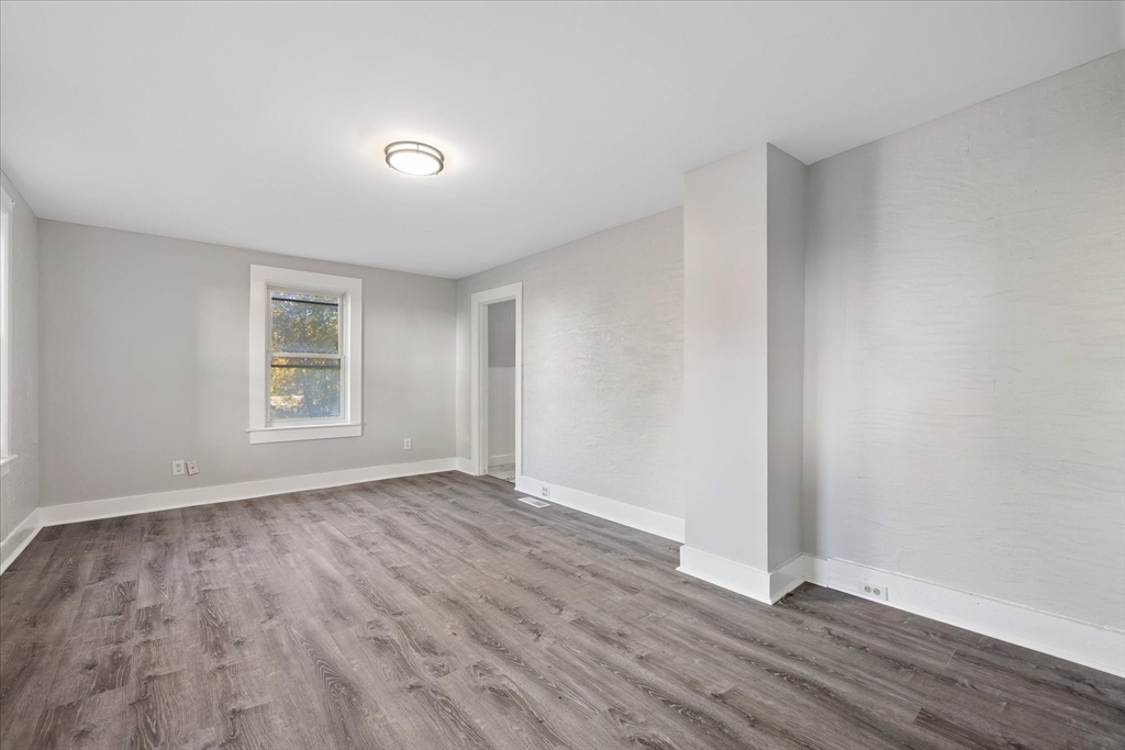 17 Otis Street Warren, MA 01083 - Photo 10 of 26 a view of an empty room with wooden floor and a window