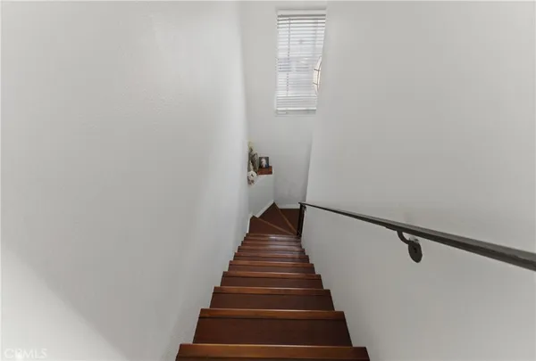 a view of a hallway with washer and dryer