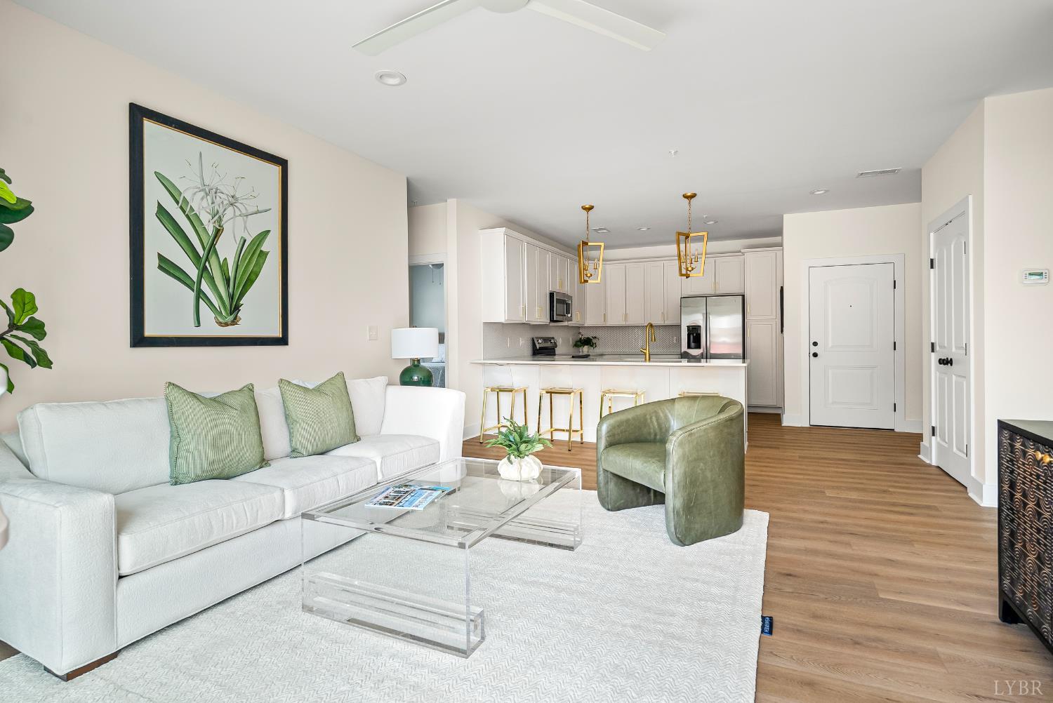 420 Capstone Drive, Unit 205 Lynchburg, VA 24502 - Photo 12 of 47 a living room with stainless steel appliances kitchen island granite countertop furniture and a wooden floor