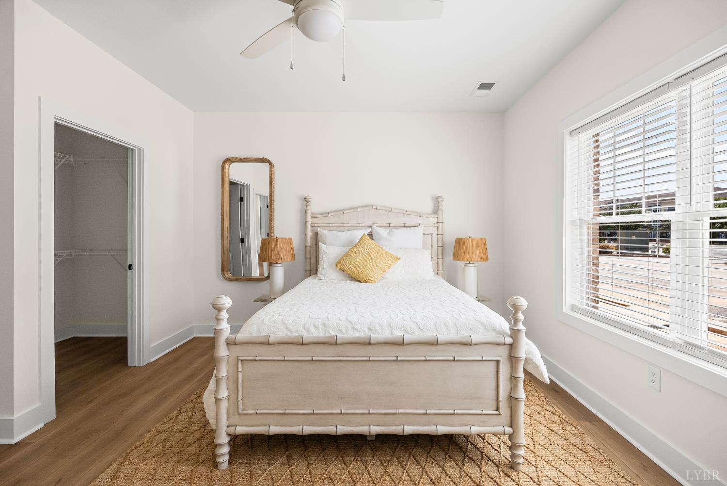 420 Capstone Drive, Unit 205 Lynchburg, VA 24502 - Photo 17 of 47 a bedroom with a bed and wooden floor
