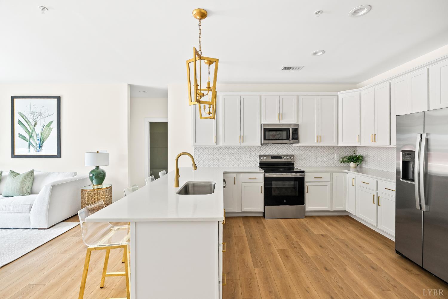 420 Capstone Drive, Unit 205 Lynchburg, VA 24502 - Photo 2 of 47 a kitchen with a sink a stove a refrigerator and a microwave