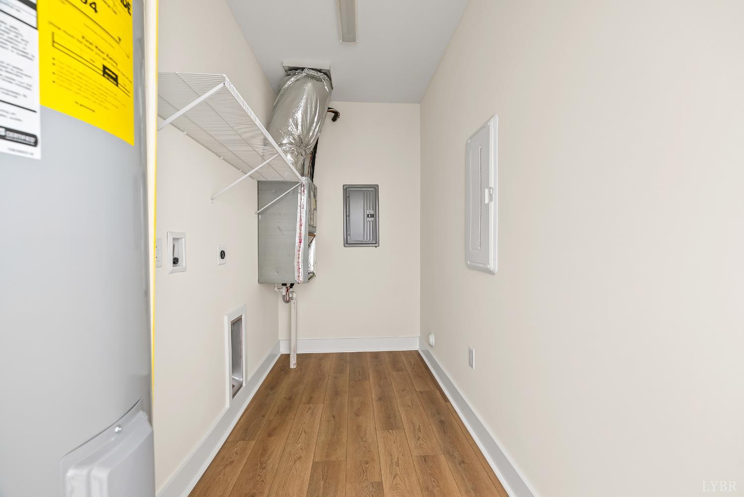 420 Capstone Drive, Unit 205 Lynchburg, VA 24502 - Photo 30 of 47 a view of a hallway with wooden floor and a chandelier