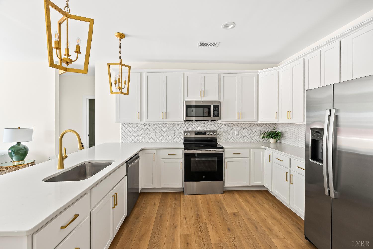 420 Capstone Drive, Unit 205 Lynchburg, VA 24502 - Photo 3 of 47 a kitchen with white cabinets appliances and sink