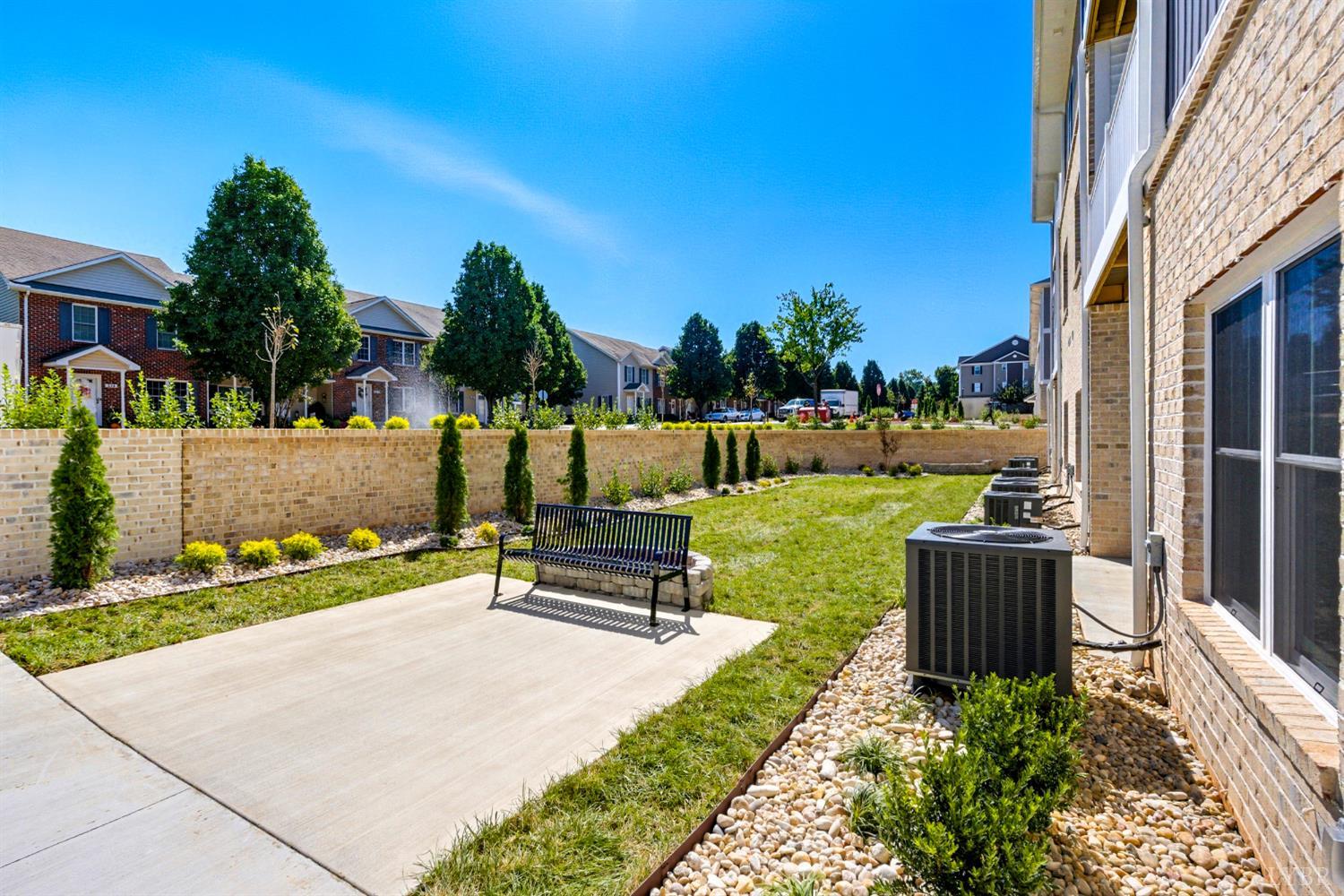 420 Capstone Drive, Unit 205 Lynchburg, VA 24502 - Photo 44 of 47 a park view with a bench in the garden