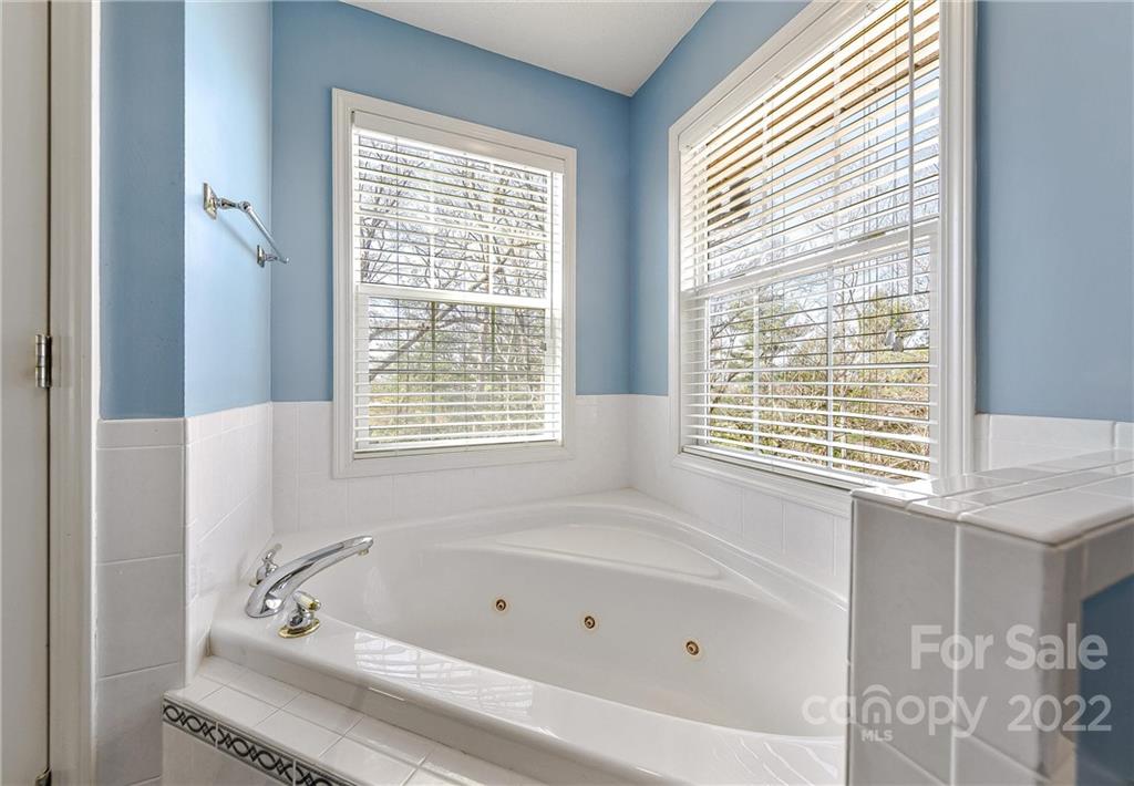 505 Kings Ridge Asheville, NC 28804 - Photo 26 of 38 a bathroom with a bathtub and next to a window