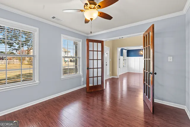 a view of livingroom with hardwood floor and hallway