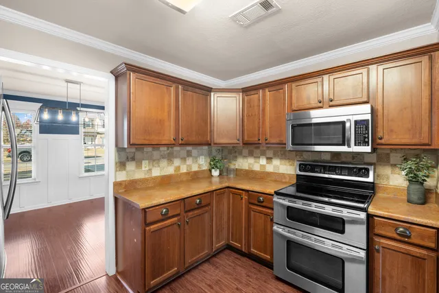 a view of livingroom with window wooden floor and front door