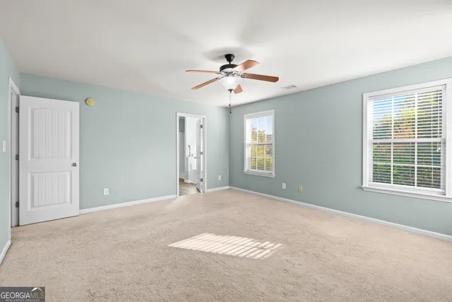 a view of a bathroom with a tub and shower