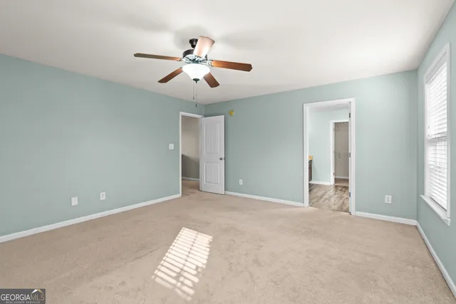 a white bath tub sitting next to a shower