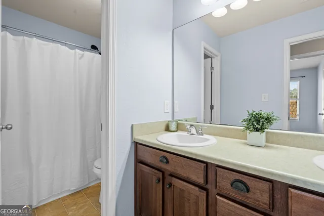 a view of dirt yard with a tree