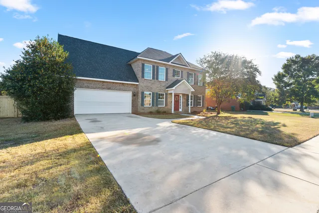 a front view of a house with a ocean view
